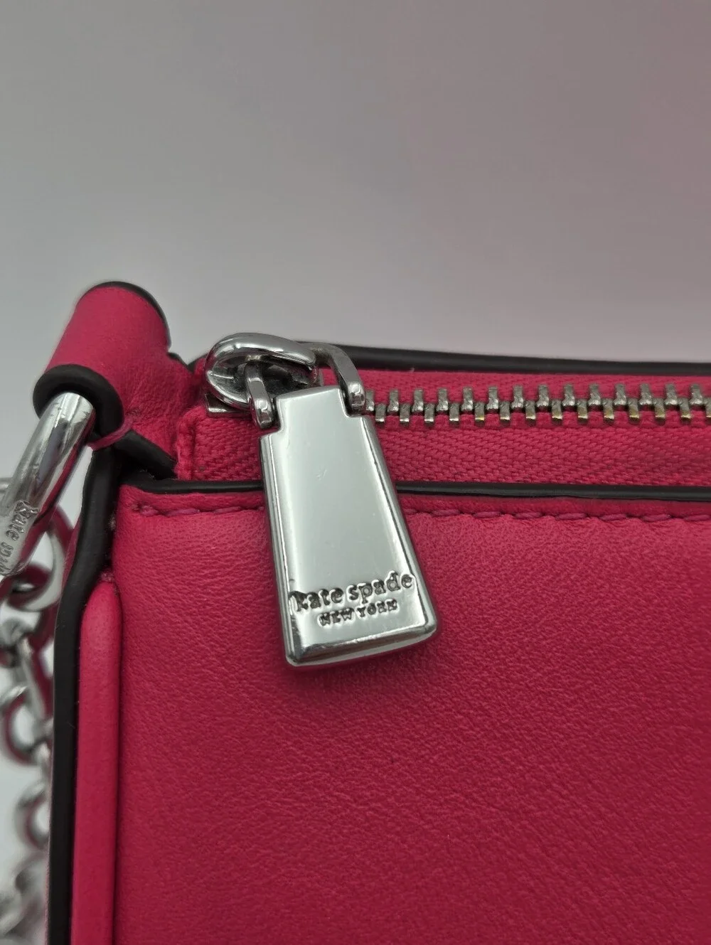 Kate Spade New York label convertible pochette in rosehip pink leather.